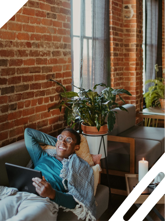 Woman with laptop and plant
